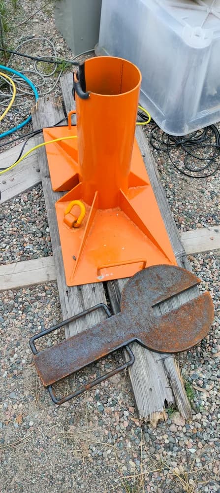 Orange borehole tool and casing components at the field site