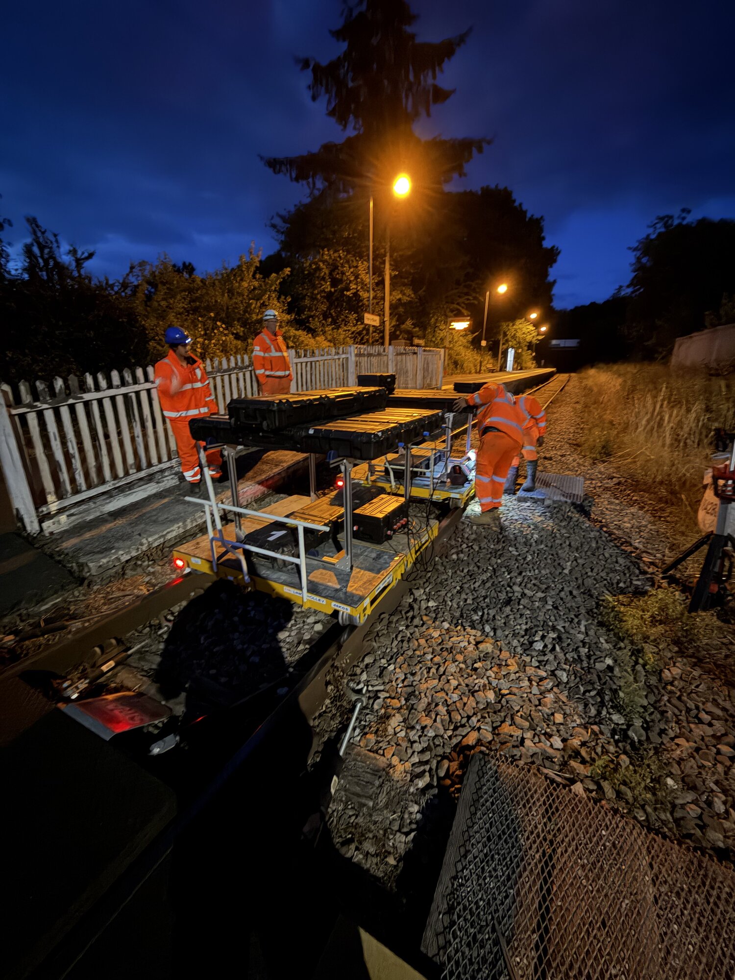 Geoptic's field team preparing the muon imaging system beside the track at Pen-y-bont Tunnel